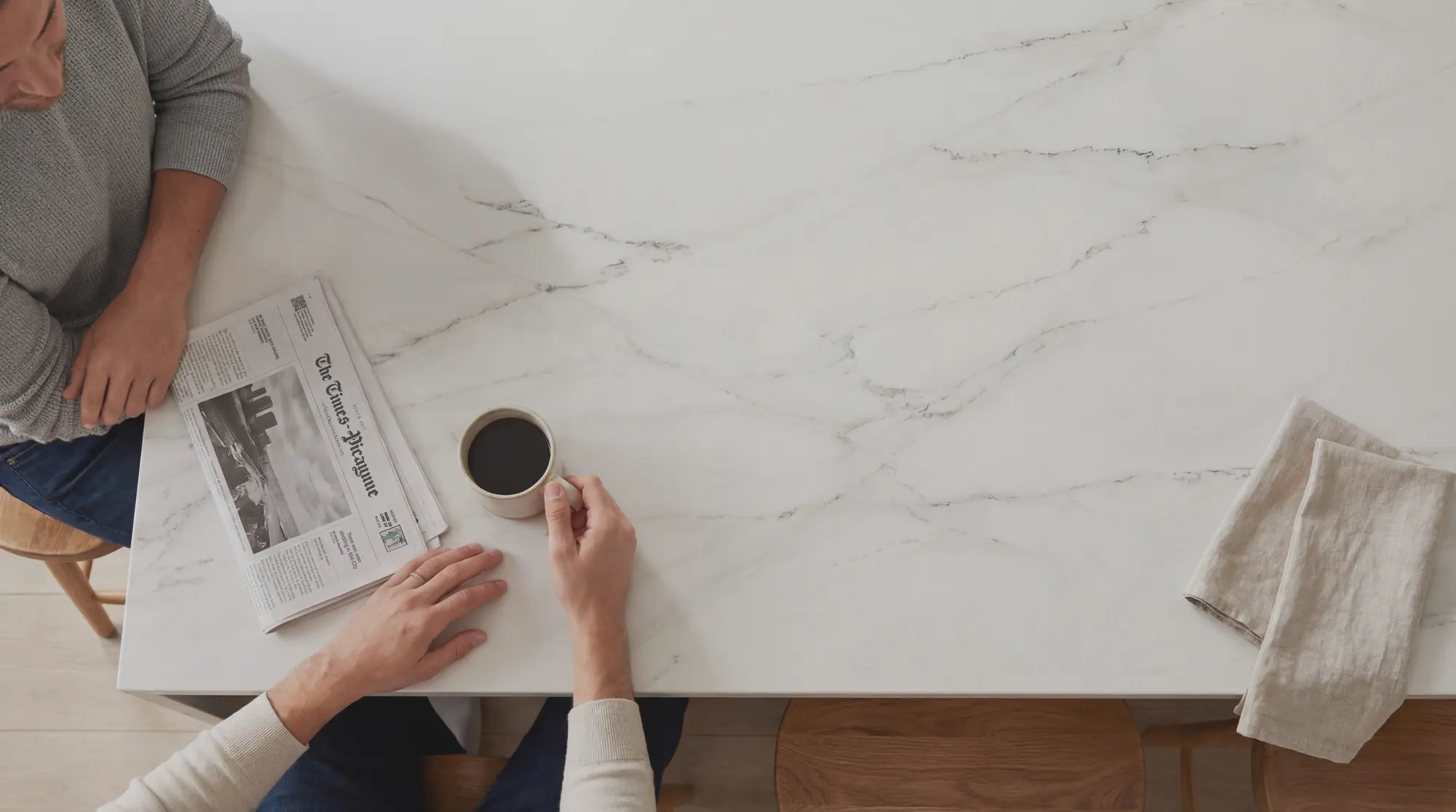 A bright marble kitchen island in morning light